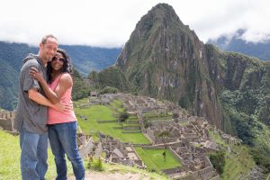 Stellner stands with her partner above the ruins of Machu Picchu